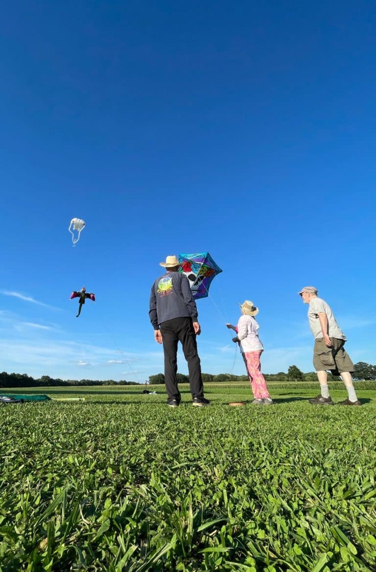 Kitemaker Glenn Davison lets visitors try out one of his kites.